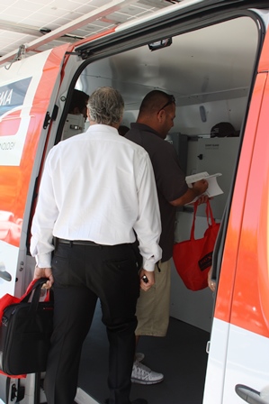 Visitors line up to walk through the SMA van and chat with our team.